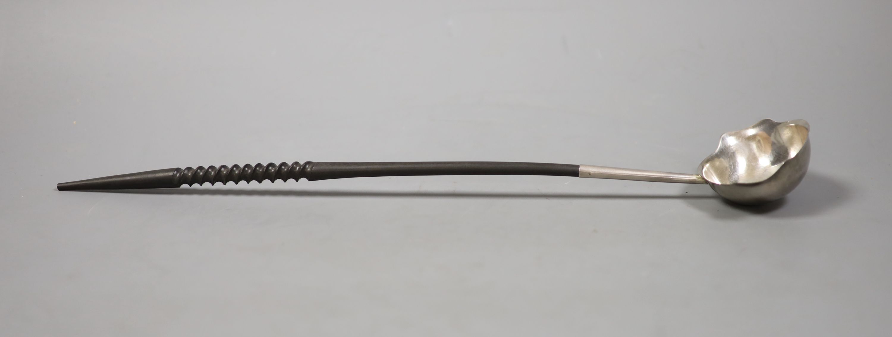 A George II silver toddy ladle with later? turned handle, maker, I.W, London, 1752, 39.4cm.